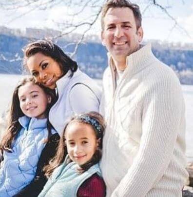 Bella with her family
